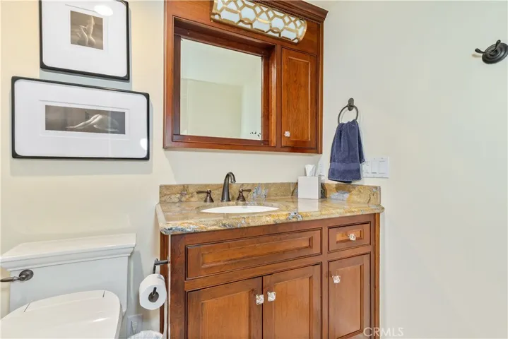 Private ensuite equipped with a 3/4 shower, sink, and toilet.
