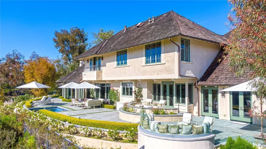 Rear view of home overlooking golf course