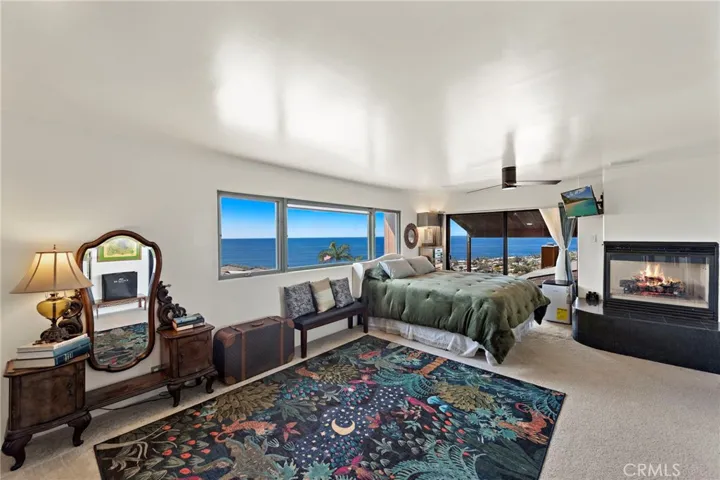 upstairs master with fireplace and panoramic ocean views and views of downtown Laguna (a peak of Hotel Laguna too!)