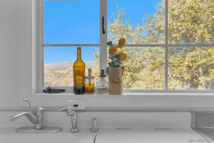 Picture window with Volcan Mountain views. Original General Electric kitchen.