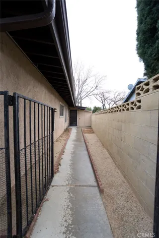 Dog run or back door to in-law quarters, plus more storage.