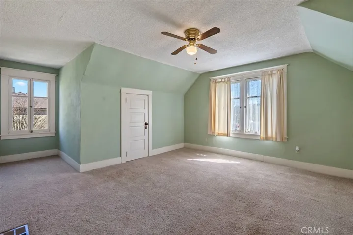 The primary bedroom offers a secluded retreat to unwind at the end of the day.
