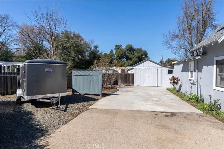 Driveway leads back to the storage building/garage.