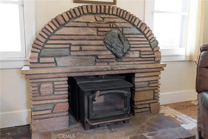 The wood burning stove will provide marvelous heat on cool evenings. What a striking surround.