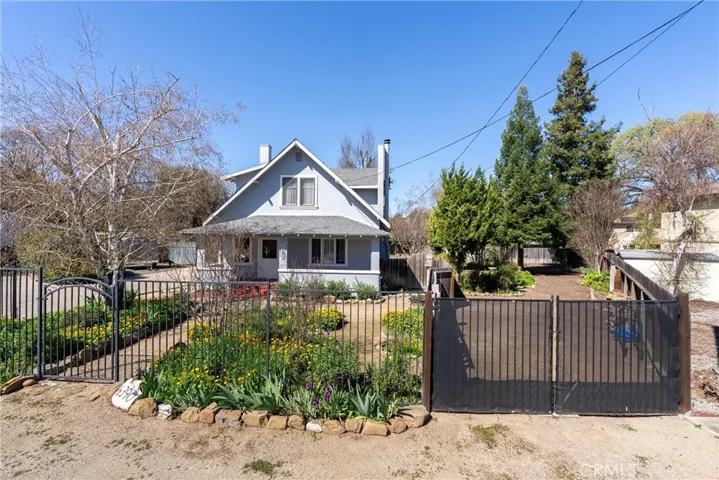 The additional parking on the side of the home has its own gate.
