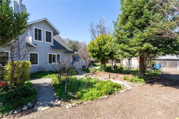 The property boasts an array of fruit, including apple, cherry, and nectarine trees, along with grape vines and strawberries!