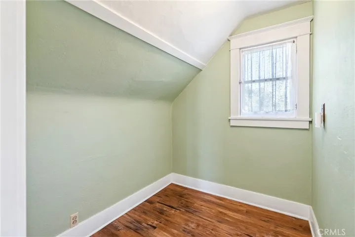 Off the primary bedroom is a space that could be transformed into a walk-in closet or use for storage.