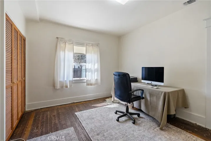 Bedroom 2 is located towards the front of the home and is currently being used as an office.