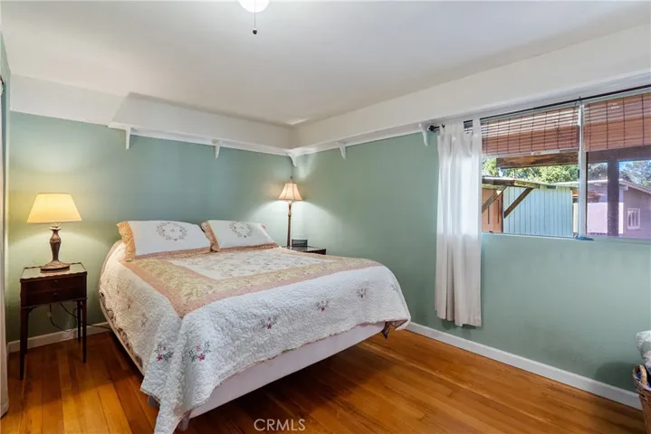 Bedroom 3 is at the back of the home and has hardwood floors.