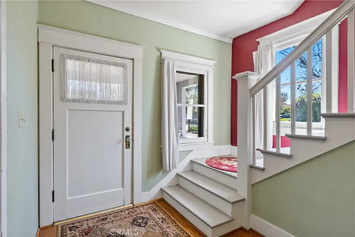 Let's go inside! Entering into the home you are immediately greeted by wood floors and vintage charm.