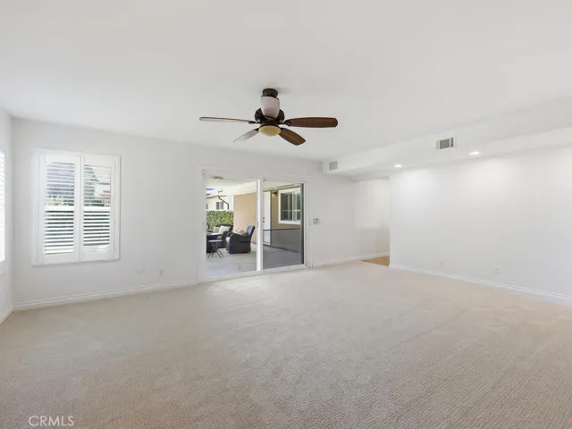 Family room leads to rear covered patio providing additional outdoor living space