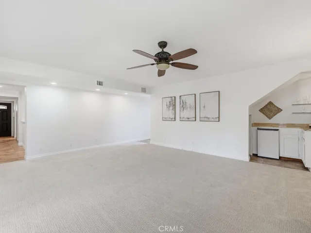 Family room with bar area and storage under stairs