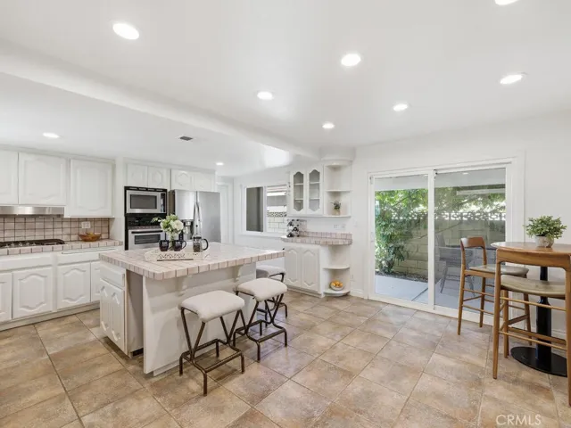 Spacious kitchen opens to side covered patio