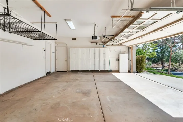 Super spacious 3-Car Garage has a plethora of storage cabinets & Drawers