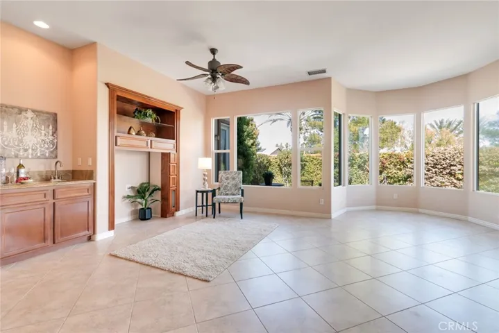 Looking at Entertainment area, includes Mini-Bar with small sink. Plenty of Light here!