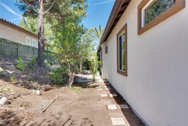 View of Side Yard from front of home; controlled by Automatic Sprinklers