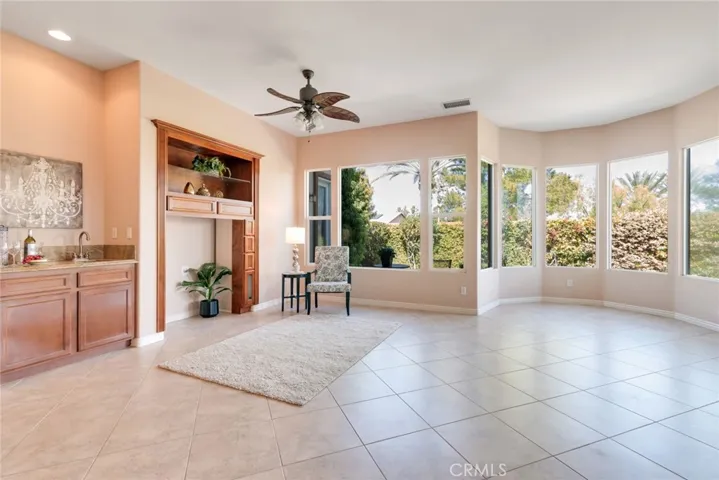Looking at Entertainment area, includes Mini-Bar with small sink. Plenty of Light here!