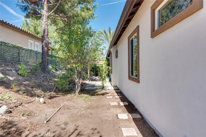View of Side Yard from front of home; controlled by Automatic Sprinklers