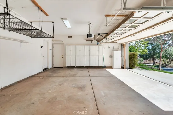 Super spacious 3-Car Garage has a plethora of storage cabinets & Drawers