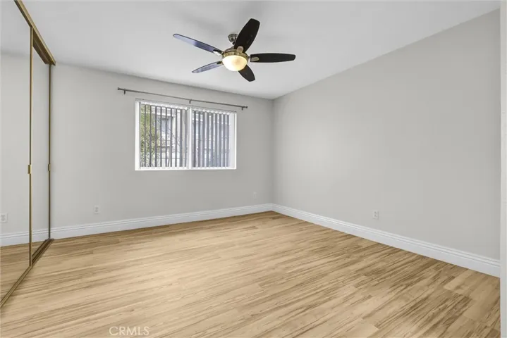 Primary bedroom #2 with new floorings plus window blinds, ceiling fans/lights and spacious mirrored closet doors with organizers