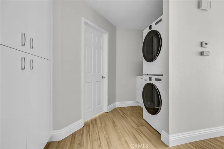 Laundry area at 2nd level with new wsher, dryer, cabinets and folding area