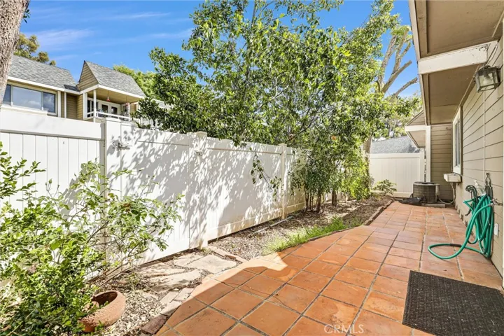 Enclosed Backyard with hardscapes and landscapes for gardening, plus locked gate access to the HOA greenbelt