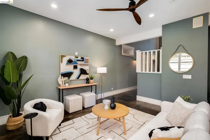 Living area featuring ceiling fan and recessed lighting
