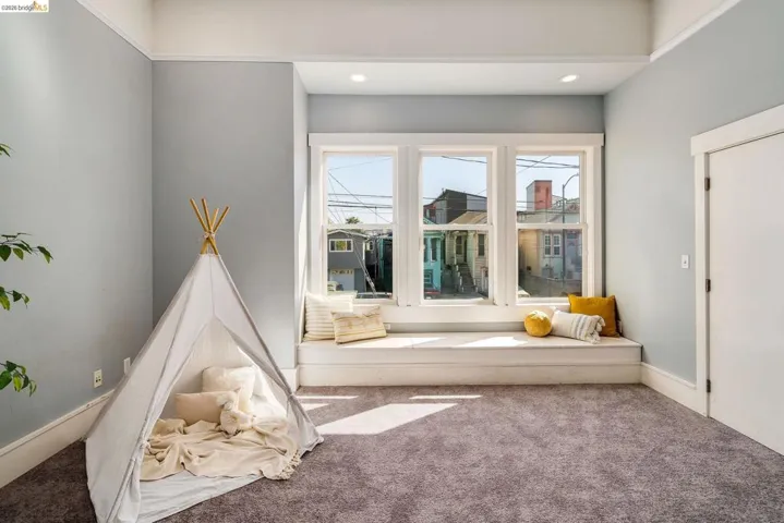 Playroom featuring carpet and baseboards