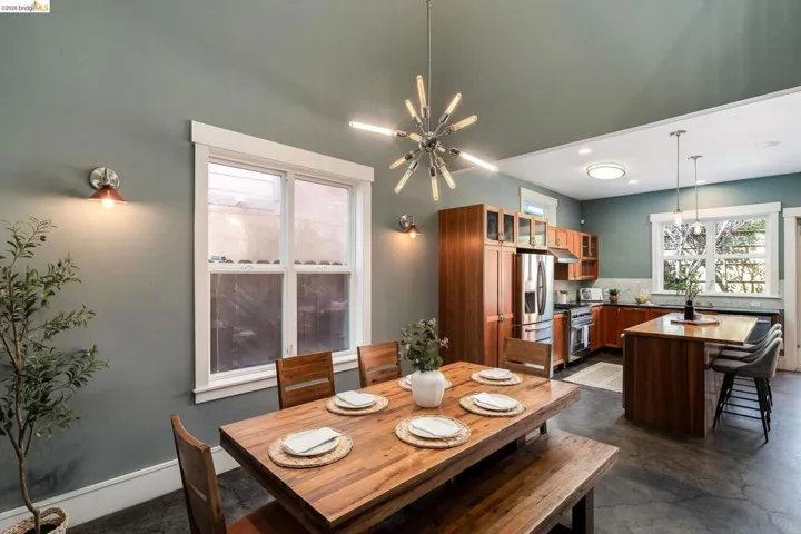 Dining space with hanging lights and concrete flooring