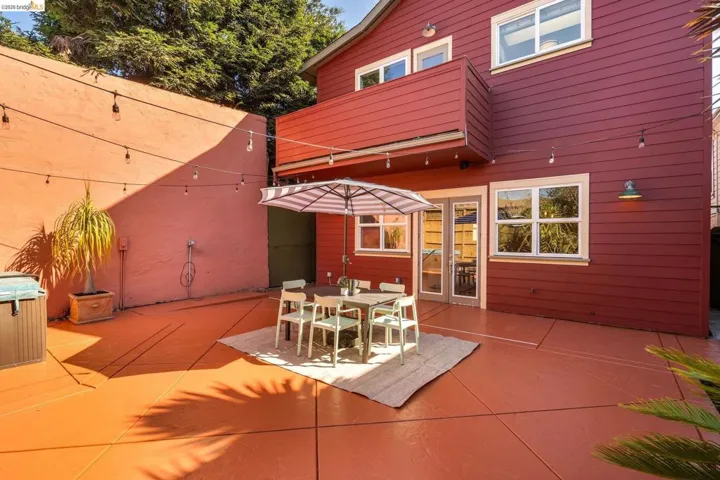 View of patio with outdoor dining space and french doors