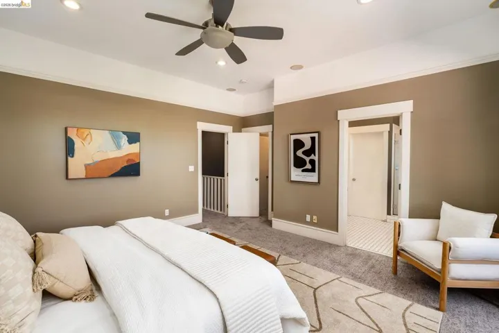 Carpeted bedroom featuring a ceiling fan and recessed lighting
