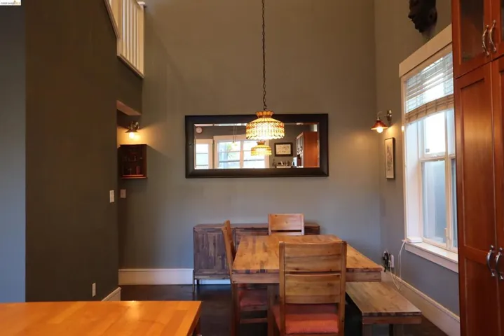Dining area with a high ceiling