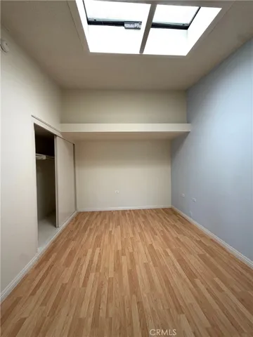 guest bedroom with skylight