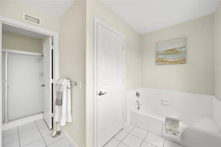 Features Soaking Bathtub and Separate Walk In Shower
