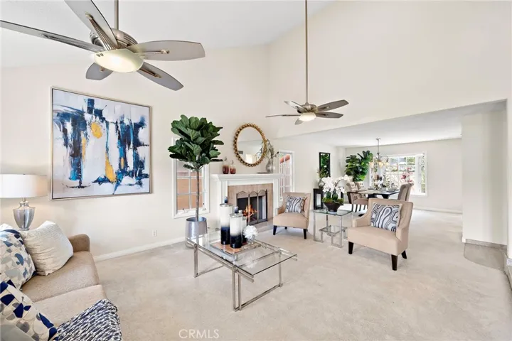 Living Room with Vaulted Ceilings and Dual Cieling Fans