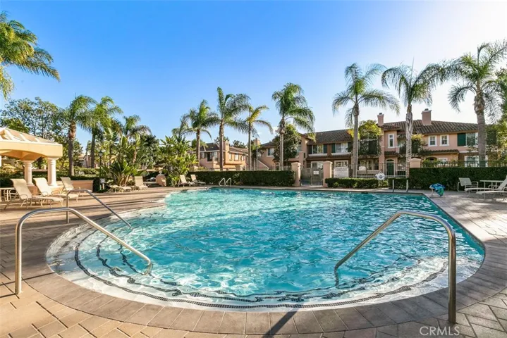 Community Spa/Pool Area – Another angle of the circular pool highlights easy entry steps, palm-lined views, and a relaxing resort feel.
