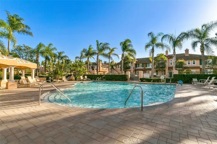 Community Spa/Pool Area – Spacious community pool and spa area is designed for unwinding, with open deck space and attractive tropical landscaping.


