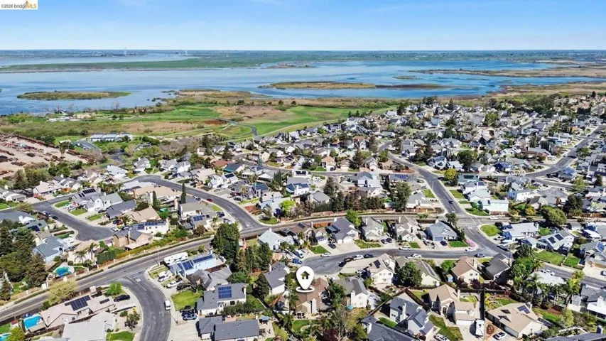 Aerial view of residential area with a nearby body of water