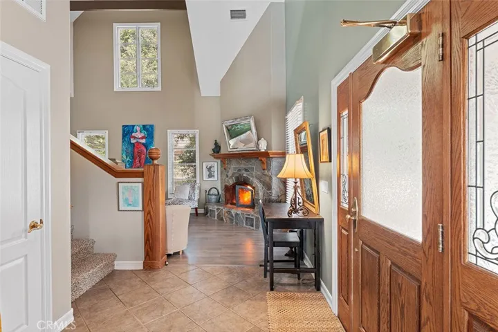 2bd/3bth Guest House entry and living room fireplace.