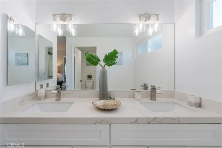 Master bathroom has been totally renovated & includes quartz counter top vanity with 2 sinks.