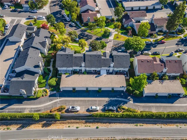 Aerial of the back of the townhomes.  This townhouse has the gray roof & is in the middle.