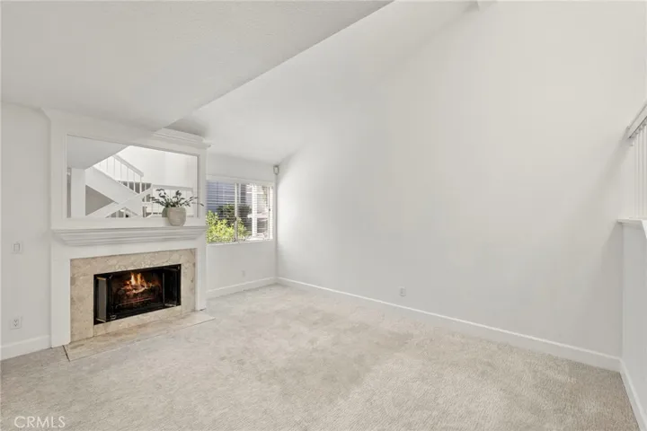 Right side of the Living room with fireplace and large window