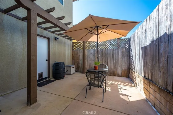 Back Patio with doors into the garage and Kitchen