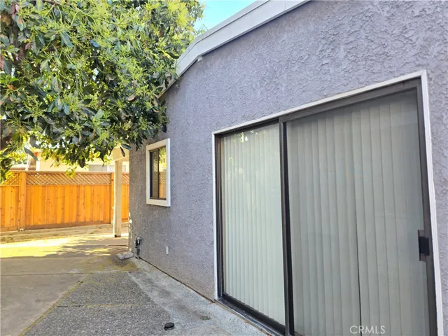Common area patio leads to 2 car garage.