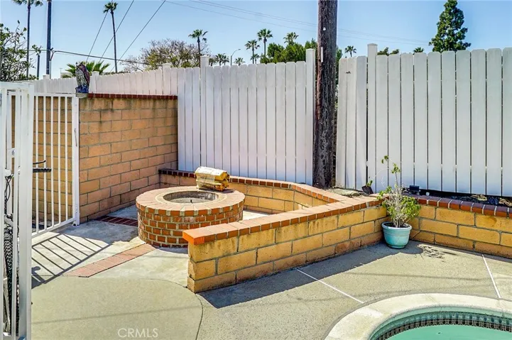 Gas Firepit. Photo from 2021. Ext floor has since been replaced with Italian Stone and walls have been stuccoed
