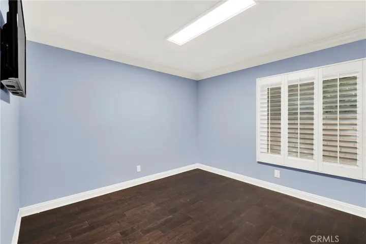 Bedroom 3. Crown Molding. Custom Wood Shutters over Milgard Windows. Center Lighting. Custom Wood Flooring. TV Custom Mounted walls fished.