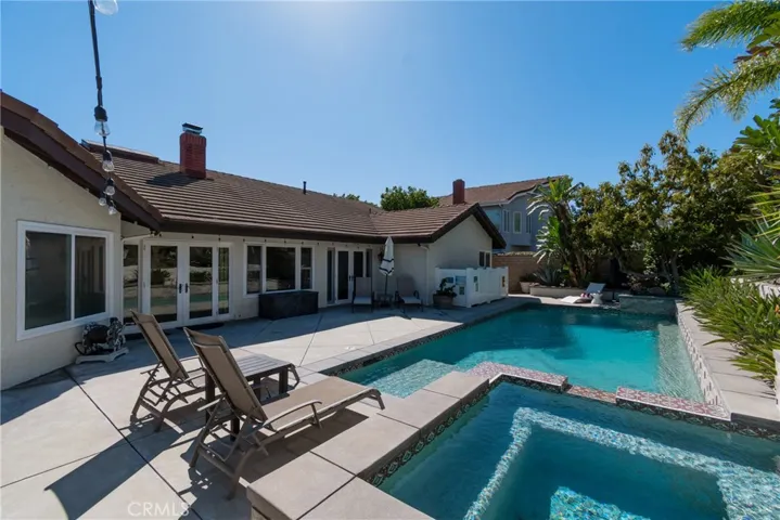 Almost full view of updated saltwater pool & spa looking towards the house.