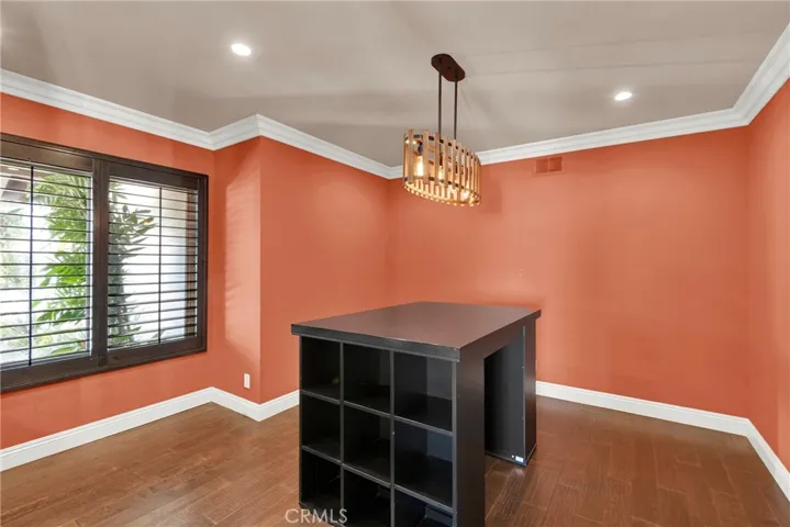 Bedroom 4 Currently used as an Office has Custom Crown Molding, Custom Wood Shutters over Milgard Windows, Recessed Lighting and Custom Center Light Fixture. Custom Center Desk and Cubby Storage is NOT fixed to the floor but can remain.