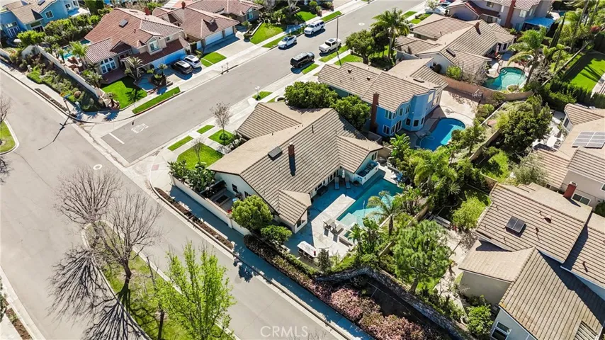 Sky view of home, lot and pool