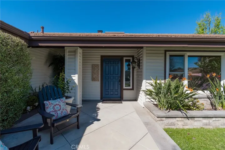 Quaint front patio and front door entrance.